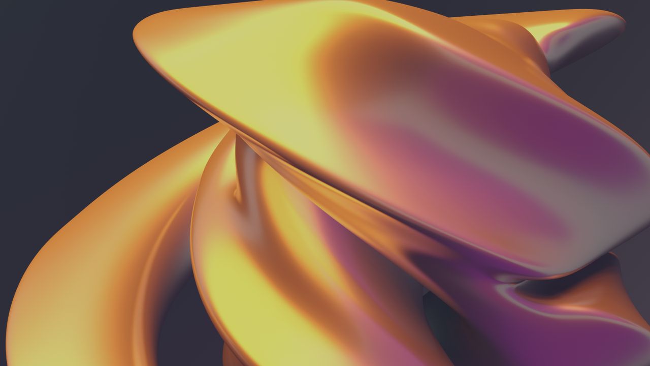 Services A close-up view of a swirling, metallic abstract sculpture in warm golden tones.
